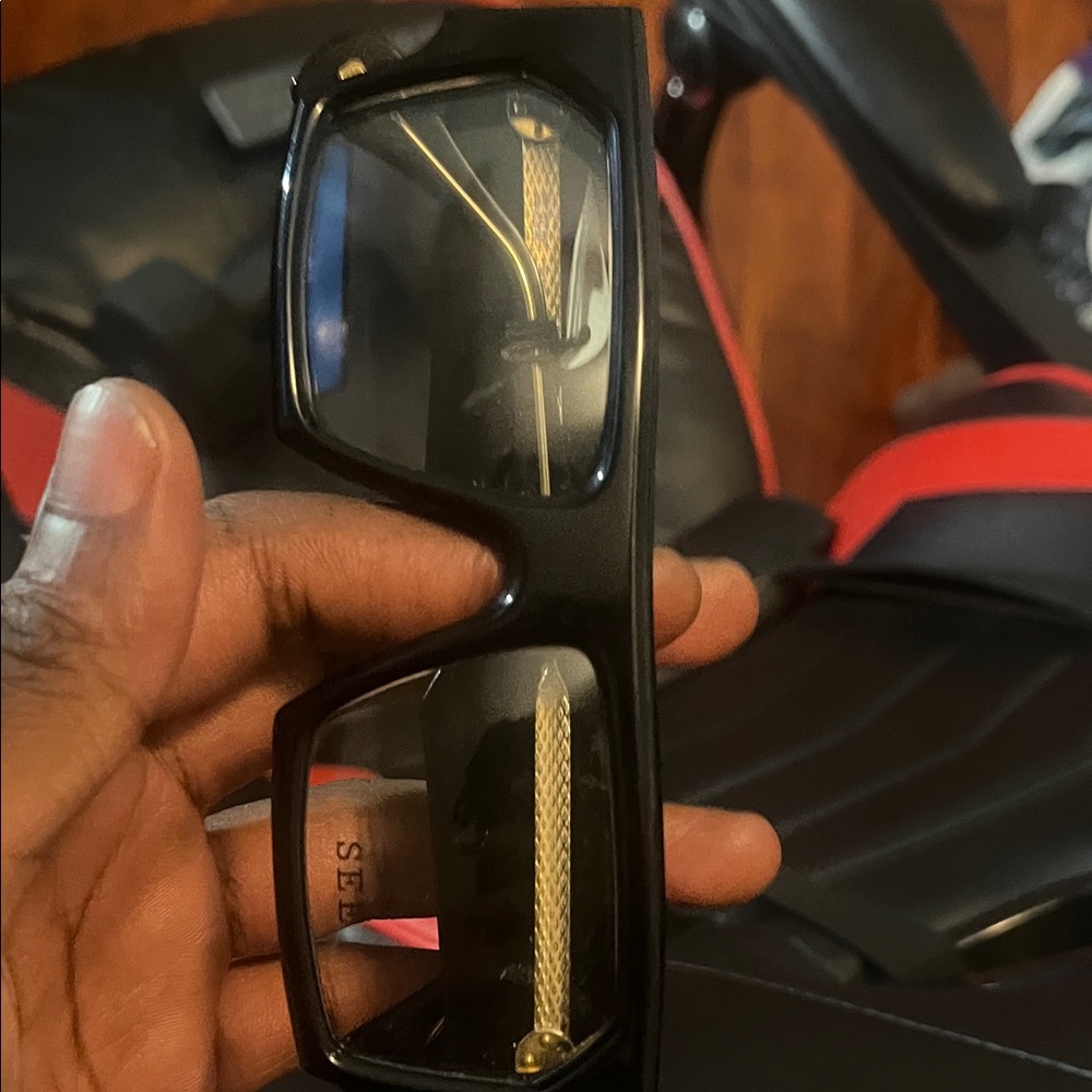 Sleek Black Glasses with Gold Detailing